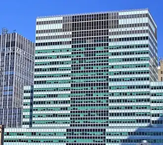 Blue-green and black facade of the 2 Broadway skyscraper
