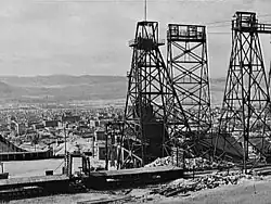 Image 8Mining headframes in Butte, MT (from History of Montana)