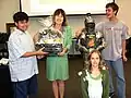 Mrs. White being presented with a gift from Krimmel Intermediate by students and the School's Mascot, Sir Technowlot