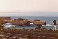 Near shore rock formation with two arches