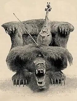Mule skull fiddle and chair displayed at the World's Columbian Exposition