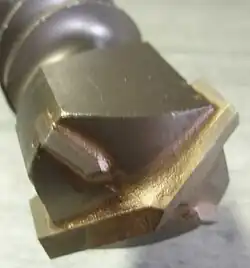 Rebar resistant bit with four carbide cutters