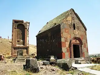 Tukh Manuk shrine with a large khachkar adjacent, the Surp Grigor Chapel is also seen in the background